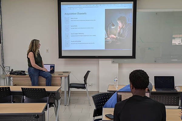 Class on campus learning about customer acquisition