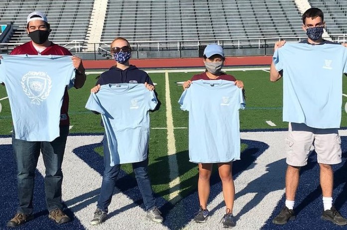 Students posing for washers champs photo