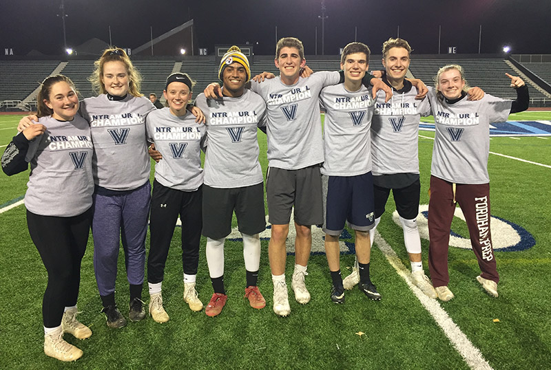 Students posing for flag football champion photo