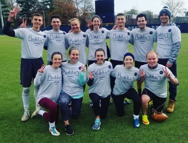 Students posing for flag football champion photo