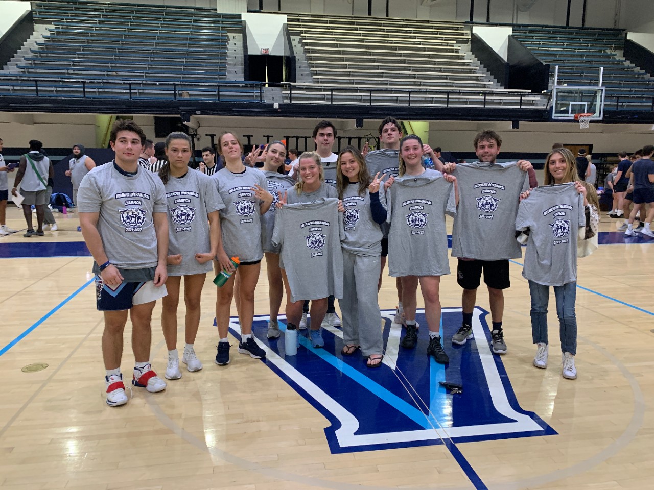Students posing for basketball champion photo