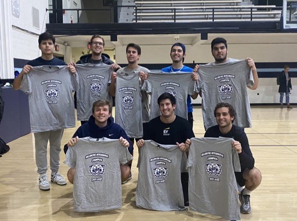 Male students posing for dodgeball champion photo