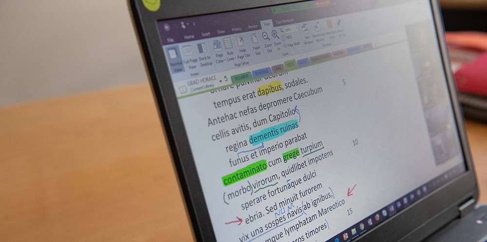 Computer screen displaying Latin text