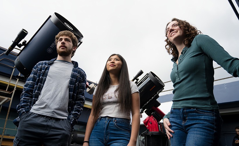 Three students in the Villanova observatory.
