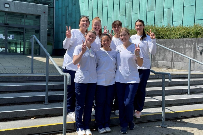 Villanova nursing students throwing a "Vs up"