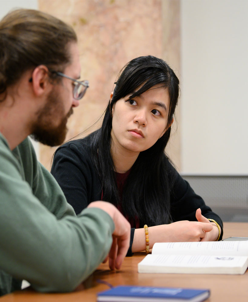 Tutor and student at table