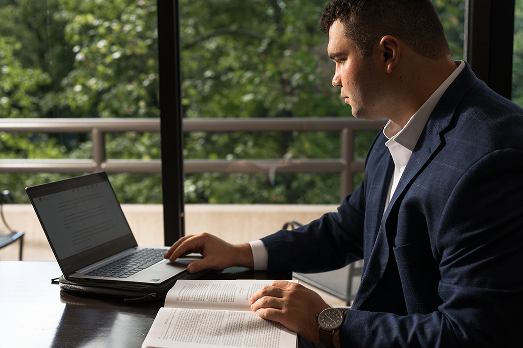 Male studying on laptop