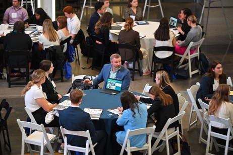 students speaking at table