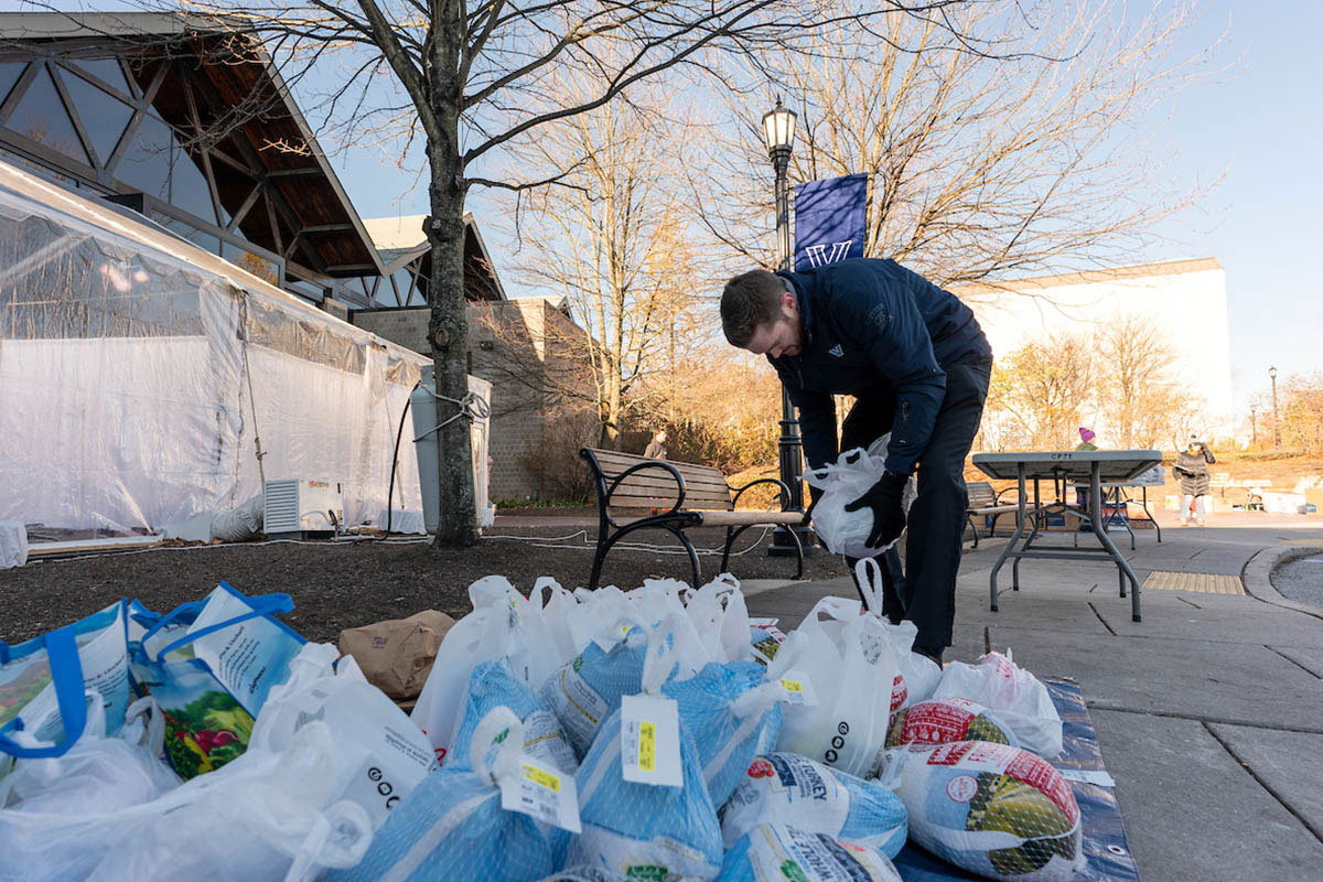 A man organizing donation items