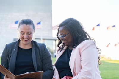 two women in front of the Washington Monument